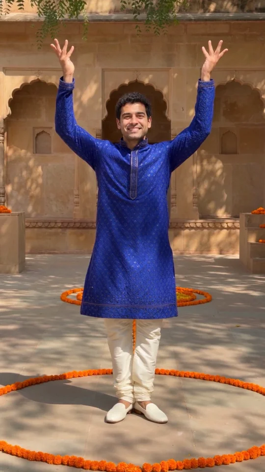 Final pose in the generated sample, smiling adult with both hands raised
