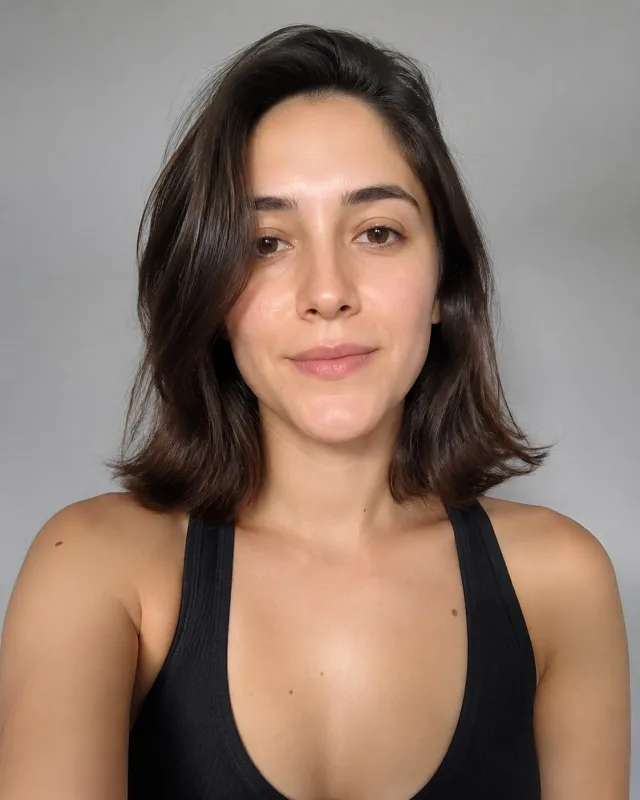Sample source photo: one person, front-facing, plain studio background