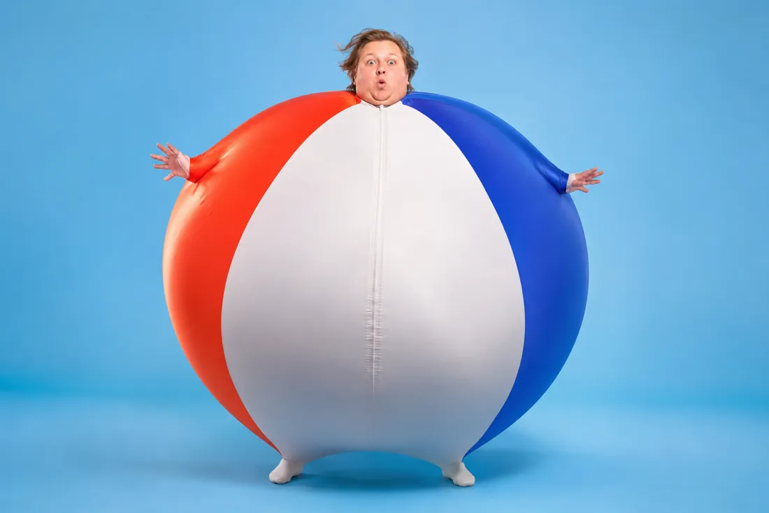 A figure at peak inflation about to spring back to normal size
