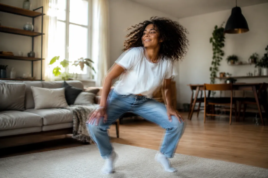 A still photo animated into a playful low-stance twerk move