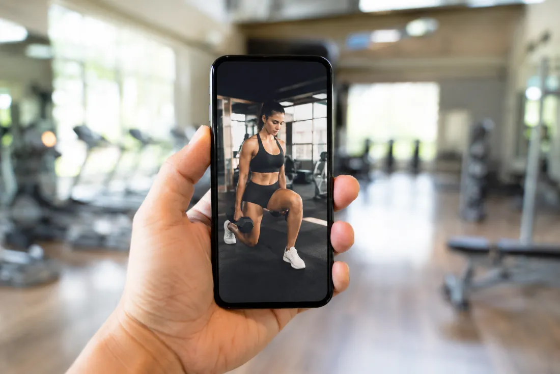 Vertical phone screen showing a finished gym workout clip ready to share