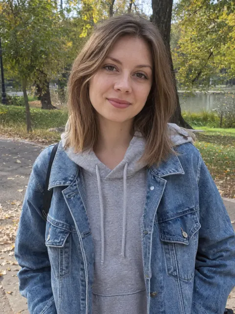 Photo 1: the survivor, a young woman in a denim jacket