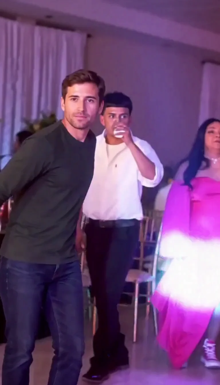 Actual generated adult walking toward the camera in the party hall