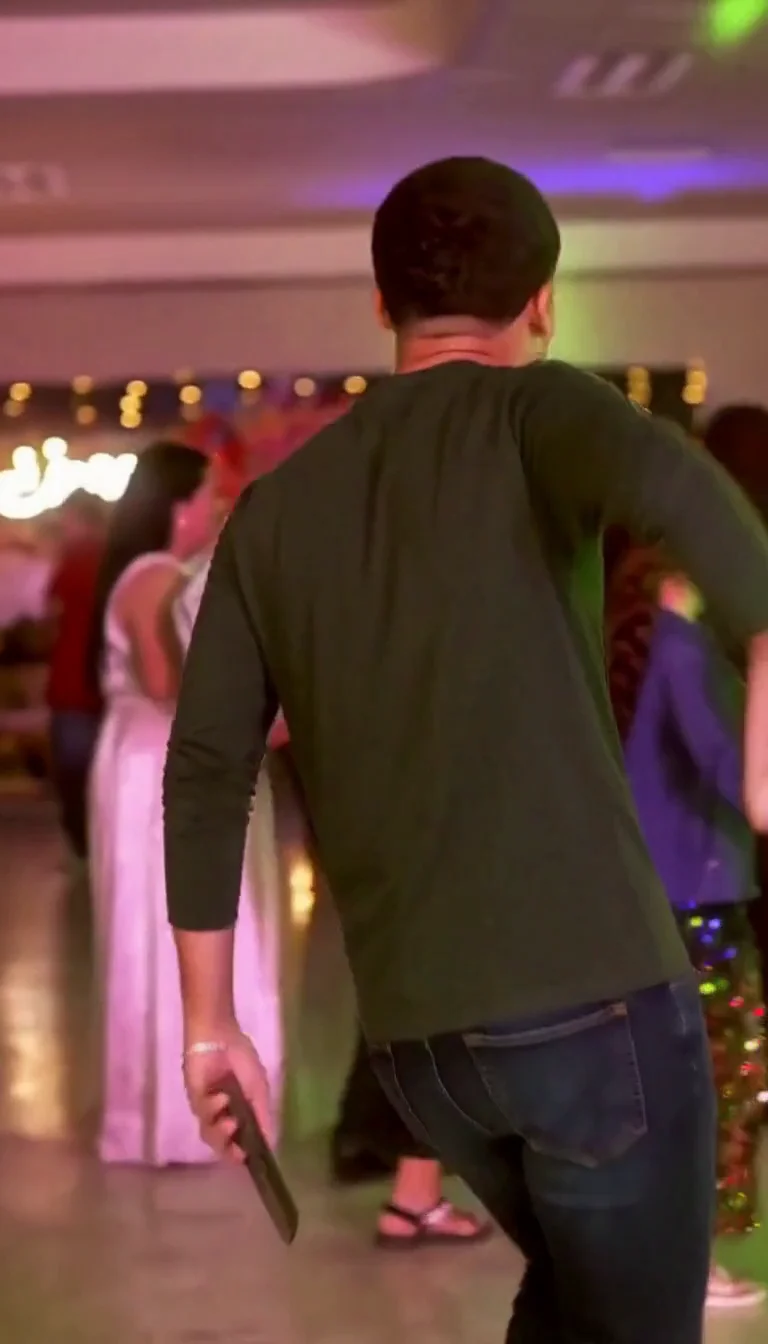 Later frame of the same generated adult turning back toward the party
