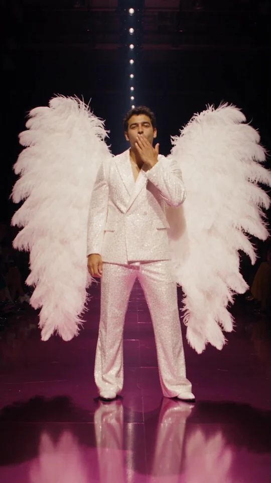 Closing pose from the generated runway sample, fictional adult blowing a kiss